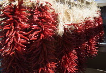 Dried chillies hanging up in the back of a pickup truck ready for market Lorry