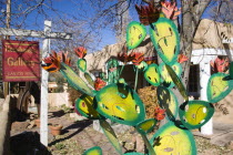 Houshangs art gallery on Canyon Road with a colourful metal sculpture of a cactus in the front garden Colorful