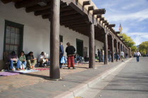 Native American Pueblo Indian market stalls under the arches of the Governors Palace in the Plaza