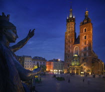 St Marys Church in Rynek Glowny with part of the Adam Miekiewicz Memorial in the foreground.TourismTravelHolidaysEastern EuropeSqaure