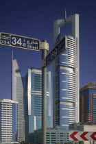Modern architecture along Sheikh Zayed Road  with road sign.TravelTourismHolidaysSkyscrapersSkyline Dubayy United Arab Emirates