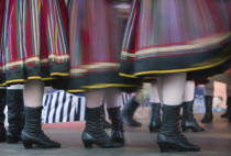 Detail of traditional dancers costumes performing in the Old Town. Moving  blurred skirts and boots.Eastern EuropeHolidaysTravelTourismColourNational DressMovementColor