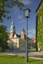 Road with lamppost and pedestrians leading up to Wawel Cathedral on Wawel Hill.Eastern EuropeHolidaysTravelTourism