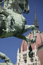 Detail of equestrian statue  Rakoczi  with Parliament behind.TourismTravelHolidaysNeo Gothic ArchitectureEastern Europe