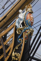 The bow of HMS Victory in the Historic Dockyard showing the bow figurehead with Royal crest
