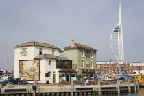 The Camber in Old Portsmouth showing the Spinnaker Tower behind the Bridge Tavern with its mural of Thomas Rowlansons cartoon titled Portsmouth Point