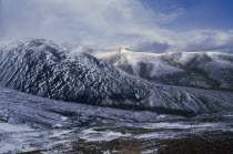 Mountain landscape in light covering of snow.