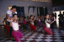 Teacher with ballet students at the Royal University of Fine Arts.