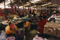 China, Tibet, Shigatse, Fruit and vegetable stalls and vendors at the Chinese market.