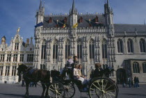 Tourist horse and carriage outside the Stadhuis in Burg Square Flemish Region