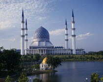 Mosque four slender towers central blue dome yellow lakeside dome Peninsular