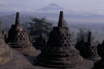Part of the temple showing bell shaped structures at dawn