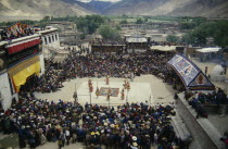 Crowds and dancers at Tibetan Full Moon Festival.