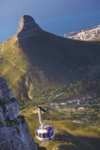 Cable car on Table Mountain with the Lions Head in the background.South AfricaTravelholidaystourismCapetownAfrican Automobile Automotive Cars Motorcar