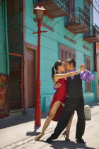 Close-up of tango dancers in La Boca.Model Release AvailableLa BocaBuenos AiresdancecoupleintimateTraveltangoLatin AmericaSouth AmericaArgentina American Argentinian Hispanic Latino