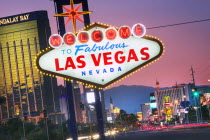 The world famous Welcome to Fabulous Las Vegas sign on Las Vegas Boulevard  The Strip  at duskLas VegasicongamblingcasinotwilightentertainmentThe StripAmericatravelUSA American North America...