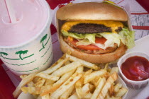 Cheeseburger  fries and strawberry milkshake.AmericaUSAiconfoodcholesteralfattemptationchipsketchuphamburgerfastfoodcomfortShake American Crisps French Fries Frites North America United S...