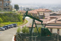 Oil well in a residential district on Signal Hill  known locally as Porcupine Hill because of the numerous oil wells dotted around the area.USAtravelAmericaLALos AngelesoilindustrypumpAmerica...