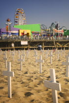 A graphic protest against the war in Iraq beneath Santa Monica Pier. Each white cross represents a member of the American armed forces who has lost their life.Santa Monica PierAmericaUSAtravelpr...