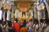 Interior of Sri Dalada Maligawa  Temple of the Tooth .Sri LankatravelAsiaKandyBuddhashrineBuddhismfish-eyeworshipprayerfait Asian Llankai Sri Lankan Kids