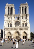 Tourists in the Place du Parvis Notre Dame in front of the west front of the Gothic Cathedral of Notre Dame on the Ile de la CiteFrench Western Europe European