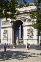 Tourists in the shade of trees in the Place de Charles de Gaulle looking at the Arc de TriompheFrench Western Europe European