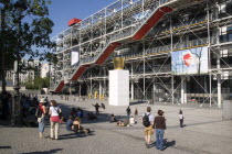 Tourists watching a street performer in the square outside the Pompidou Centre in Beauborg Les HallesFrench Western Europe European