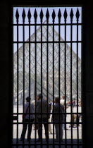 Tourists outside the pyramid entrance to the Musee du LouvreFrench Western Europe European