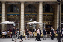 People at tables with pedestrians walking past outside the Cafe Bar Le Nemours in Place ColetteFrench Western Europe European