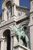 Montmartre The facade of the church of Sacre Couer with the bronze equestrian statue of Joan of Arc by H LevebureFrench Western Europe European