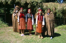 Girls dressed in Bulgarian national costume and men dressed as hunters.TravelTourismHolidayVacationAdventureExploreRecreationLeisureSightseeingTouristAttractionTourChalinValogBanskoBul...