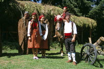 Girls dressed in Bulgarian national costume and men dressed as hunters.TravelTourismHolidayVacationAdventureExploreRecreationLeisureSightseeingTouristAttractionTourChalinValogBanskoBul...
