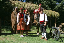 Girls dressed in Bulgarian national costume and men dressed as hunters.TravelTourismHolidayVacationAdventureExploreRecreationLeisureSightseeingTouristAttractionTourChalinValogBanskoBul...