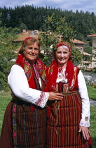 Member of Dobarski Babi Folk Group  and tourist on right  in national costumeTravelTourismHolidayVacationAdventureExploreRecreationLeisureSightseeingTouristAttractionTourDobarskoBanskoB...
