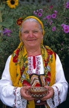 Dobarski Babi Folk Group  member of folk group holding bowl of salt.TravelTourismHolidayVacationExploreRecreationLeisureSightseeingTouristAttractionTourDobarskoBanskoBulgariaBulgarianD...