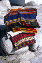 Colourful blankets on display on rocks outside gift and craft shop.Colorful Store TravelTourismHolidayVacationAdventureExploreRecreationLeisureSightseeingTouristAttractionTourBanskoBulga...