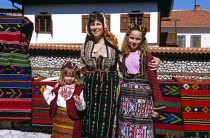 Mother and daughters wearing national costumeMumTravelTourismHolidayVacationAdventureExploreRecreationLeisureSightseeingTouristAttractionTourBanskoBulgariaBulgarianLadyWomanFemalePe...