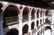 Monastic cells  balconies and courtyard  Rila Monastery.TravelTourismHolidayVacationAdventureExploreRecreationLeisureSightseeingTouristAttractionTourHistoryHistoricHistoricalNativityC...