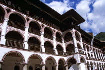 Monastic cells  balconies and courtyard  Rila Monastery.TravelTourismHolidayVacationAdventureExploreRecreationLeisureSightseeingTouristAttractionTourHistoryHistoricHistoricalNativityC...