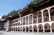 Monastic cells  balconies and courtyard  Rila Monastery.TravelTourismHolidayVacationAdventureExploreRecreationLeisureSightseeingTouristAttractionTourHistoryHistoricHistoricalNativityC...