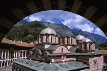 Nativity Church from balcony through arch  Rila Monastery.TravelTourismHolidayVacationAdventureExploreRecreationLeisureSightseeingTouristAttractionTourHistoryHistoricHistoricalNativity...