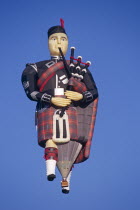 Scotsman playing bagpipes hot air balloon Great Britain UK United Kingdom TravelTourismHolidayVacationAdventureExploreRecreationLeisureSightseeingTouristAttractionTourDestinationTripJou...