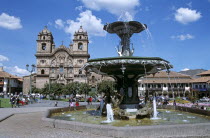Iglesia La Compania de Jesus  and ornate fountain  Plaza de Armas.Cuzco TravelTourismHolidayVacationExploreRecreationLeisureSightseeingTouristAttractionTourDestinationPlazaDeArmasCusco...