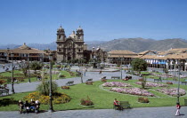 Looking across Plaza de Armas to Iglesia La Compania de Jesus.Cuzco TravelTourismHolidayVacationExploreRecreationLeisureSightseeingTouristAttractionTourDestinationPlazaDeArmasCuscoCuz...