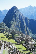 Inca ruins  terraces and Huayna Picchu.Cuzco TravelTourismHolidayVacationExploreRecreationLeisureSightseeingTouristAttractionTourDestinationMachuPicchuMachupicchuHuaynaWaynaPeruPeru...