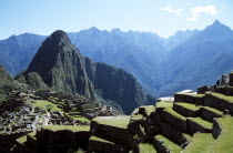 Inca ruins  terraces and Huayna Picchu.Cuzco TravelTourismHolidayVacationExploreRecreationLeisureSightseeingTouristAttractionTourDestinationMachuPicchuMachupicchuHuaynaWaynaPeruPer...