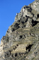 Granary or grain silo on Pinkuylluna Mountain  Sacred Valley of the Incas.Cuzco TravelTourismHolidayVacationExploreRecreationLeisureSightseeingTouristAttractionTourDestinationOllantaytamb...