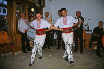Male dancers in national costume dancing.TravelTourismHolidayVacationExploreRecreationLeisureSightseeingTouristAttractionTourArbanassiBulgariaBulgarianEastEasternEuropeEuropeanEnter...