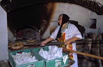 Ethnographic Outdoor Village Museum  near Gabrovo. Old lady baking bread.TravelTourismHolidayVacationAdventureExploreRecreationLeisureSightseeingTouristAttractionTourEthnographicEthnogra...