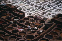 The Tanneries with view over workers in dye pitsFes African al-Magrib Fez Moroccan North Africa